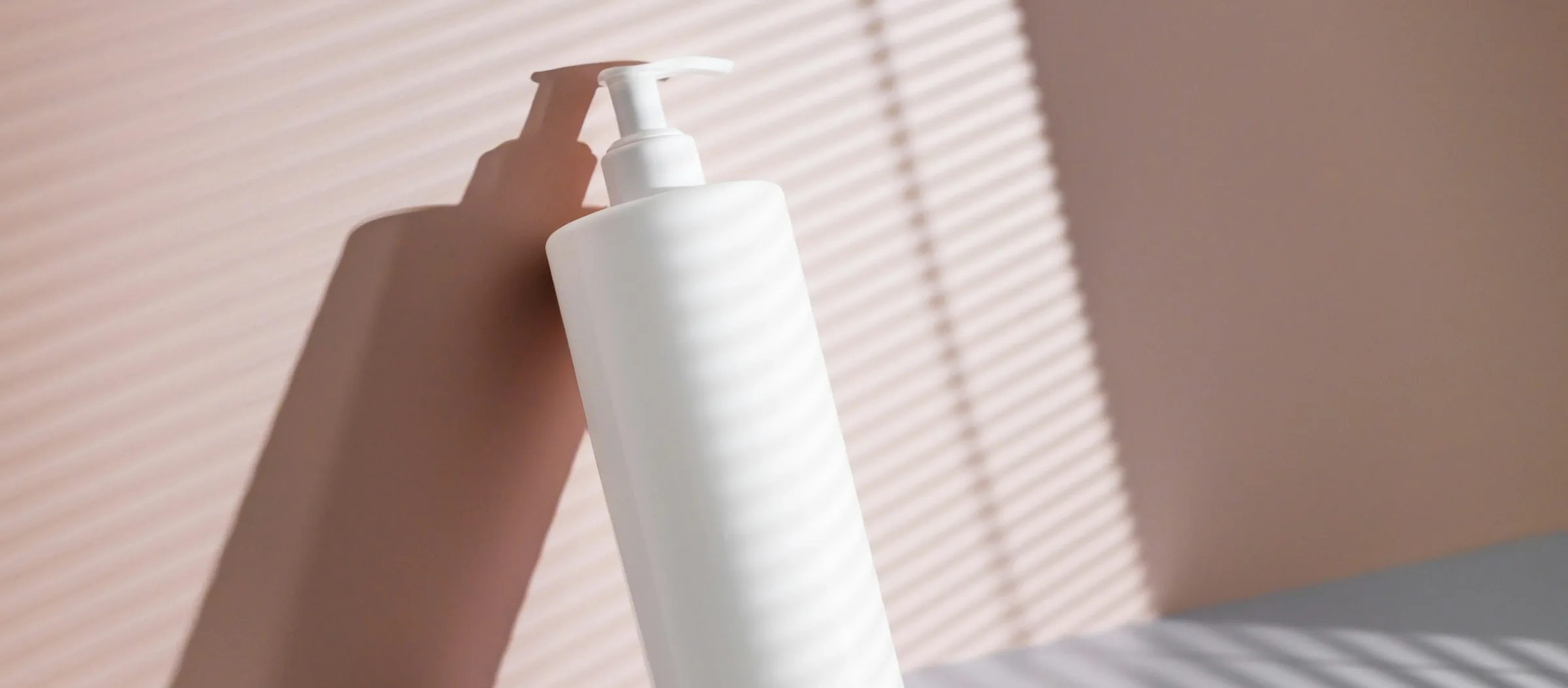 Lumea pump bottle in striped morning light