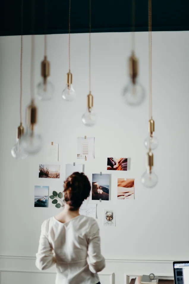 Designer reviewing a moodboard wall